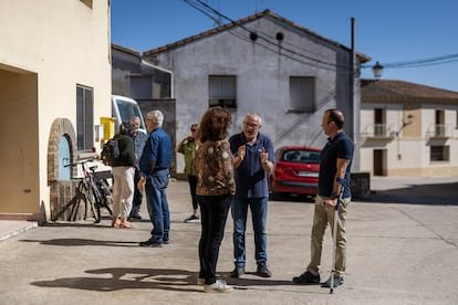 Residents of the district of Cuarte, in the municipality of Huesca (Spain), chat after a meeting to discuss the impact of the future Amazon Web Services (AWS) data center in the Walqa industrial park, near the town.