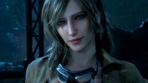 Konami A video game character rendered in modern, high-quality graphics. She has long dirty blonde hair and blue eyes. She is wearing a jacket and has goggles hanging around her neck.