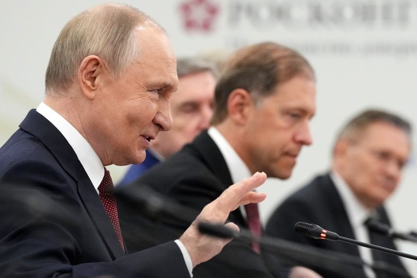 Russian President Vladimir Putin speaks on the sidelines of the St. Petersburg International Econimic Forum in St. Petersburg, Russia, on June 20.
