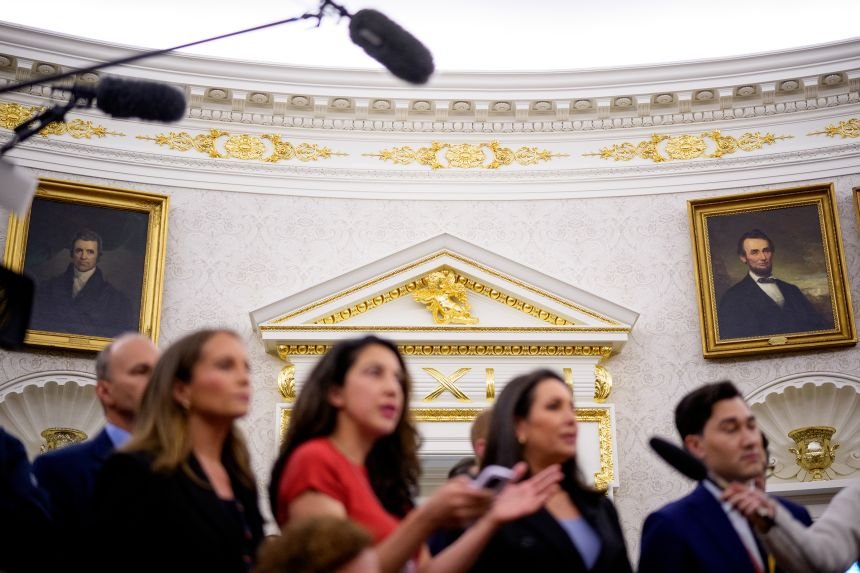 Paintings, gold trim and a cherub statues are seen behind reporters in the Oval Office of the White House on May 28, in Washington, DC.
