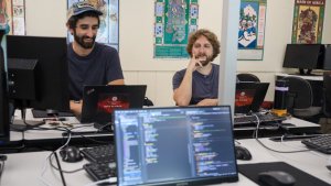 Two students working in a computer lab