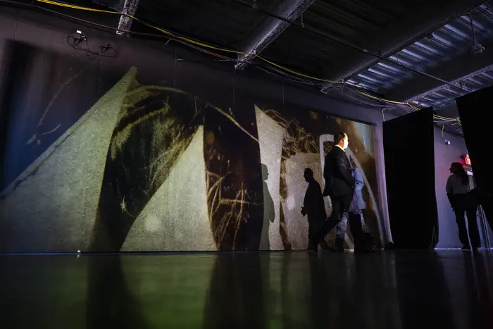 People walk by "The Endless Mile" art installation at AI Horizons. 