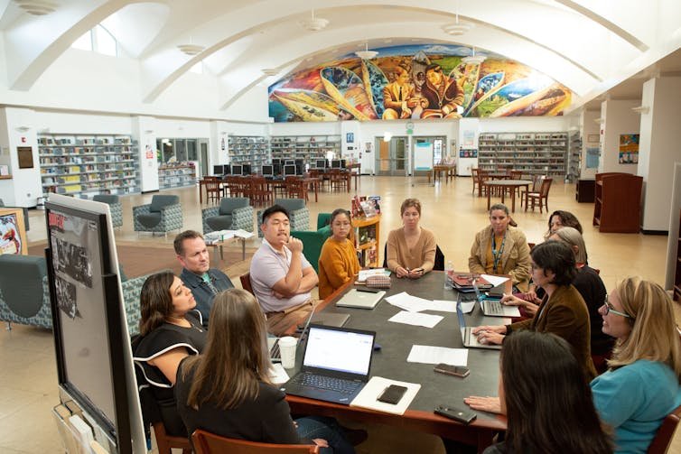 People meeting around a table.