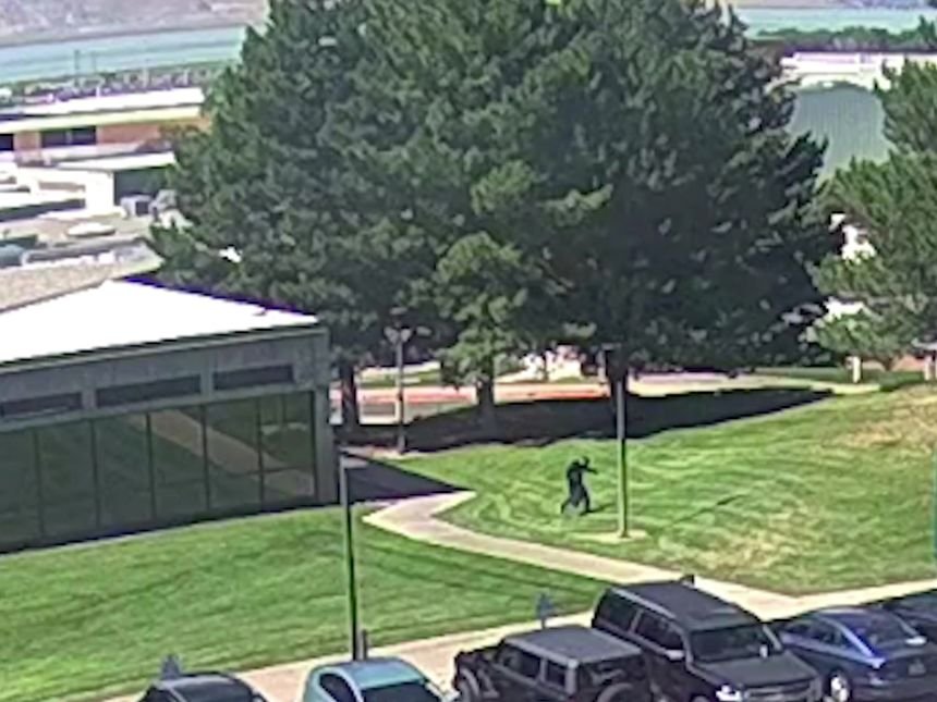 A still from a video released by the FBI of the shooter in Utah Valley. The subject is seen jumping from the rooftop of a building after the shooting.